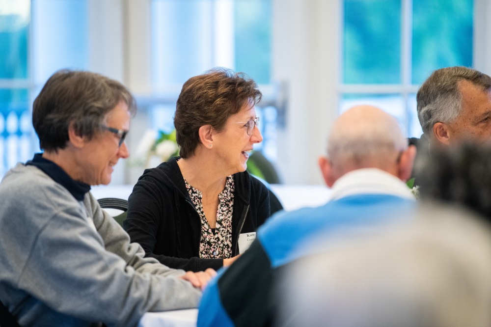 Kathy Crandall smiling next to Diane Houge